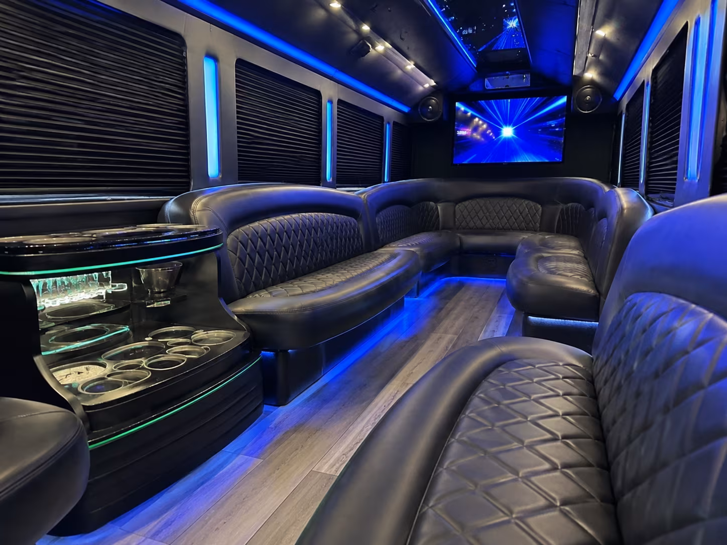 Wraparound seating inside a party bus rental serving Minneapolis